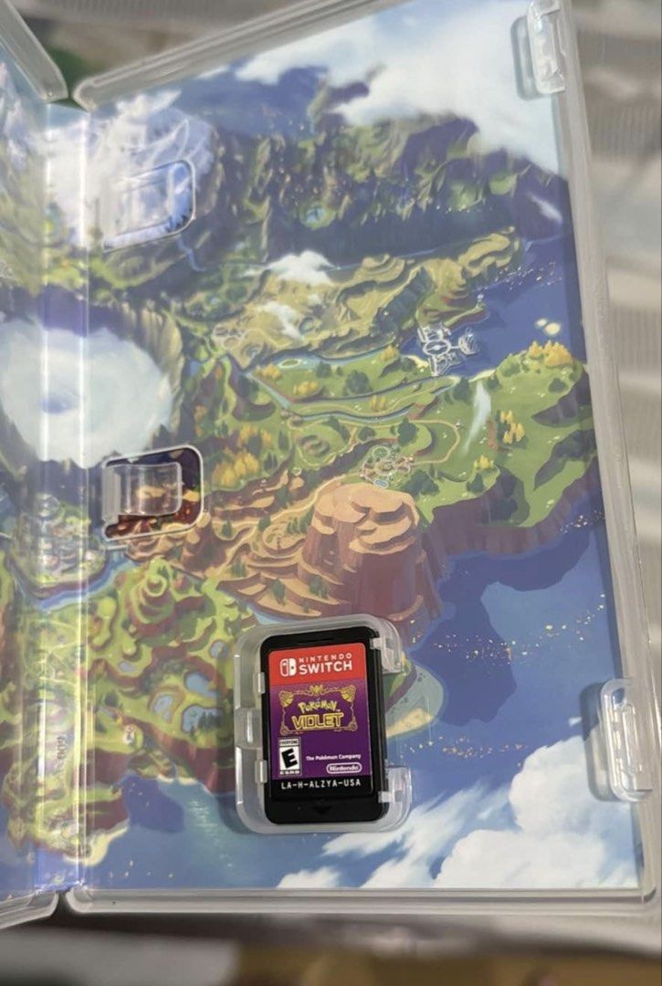 Pokemon Violet Game Cartridge (Category: Nintendo) located in Manila. Submitted by nongiesh (Listing ID 1464396198, Image 2). Description: - Pokemon Violet for Nintendo Switch - USA Region - Includes game cartridge and case - Game map printed inside the case.