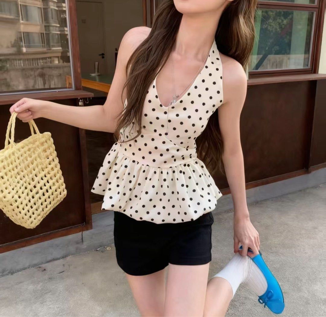 Polka Dot Halterneck Peplum Top (Category: Sleeveless) located in Pasig City. Submitted by dairob1203 (Listing ID 1464507894, Image 1). Description: - Cute white top with black polka dots - Halterneck style with tie-back closure - Flattering peplum hem - Versatile: pairs well with shorts or skirts - Ideal for casual wear, beach trips, or a day out - Easy to style.
