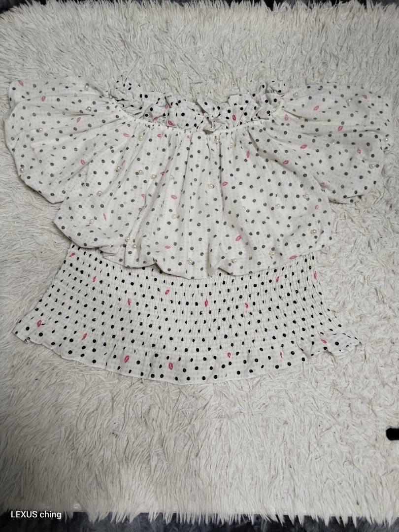 Polka dot off shoulder ruffled overlay top with pearl beading (Category: Blouses) located in Manila. Submitted by lexusthrift1995 (Listing ID 1464359377, Image 3). Description: Size- MEDIUM to LARGE Color rate- 10/10 Condition- 10/10 issue- no issue good condition ‼️150.pesos plus shipping fee 💸MODE OF PAYMENT- GCASH payment first 🚛MODE OF DELIVERY- J&T or LALAMOVE 📍LOCATION- NORTH CALOOCAN CAMARIN BRGY.177 1705 SUNFLOWER STREET. 🗒Note: Pleas