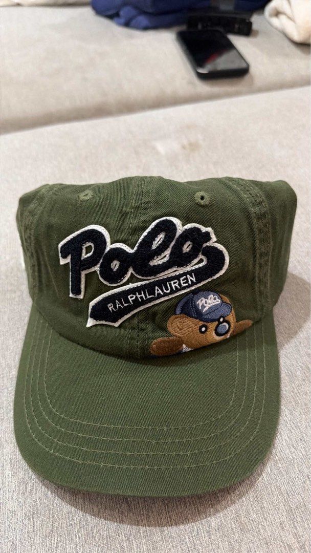 Polo Ralph Lauren Bear Cap (Category: Caps & Hats) located in Las Pinas. Submitted by jsm.g (Listing ID 1464526328, Image 1). Description: - Brand: Polo Ralph Lauren - Color: Green - Design: Iconic Polo logo with a cute bear graphic - Back Detail: Embroidered 'Polo Bears' - Size: One size fits all - Material: 100% Cotton - Style: Great for casual wear SAME CONDITION AND TAGS FOR ALL 4 COLORS (army green, evergreen, red, and white) 950 EACH.