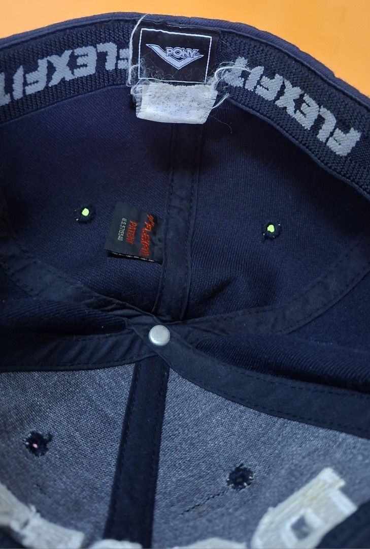 PONY Flexfit Baseball Cap Navy Blue (Category: Caps & Hats) located in Manila. Submitted by declutrredgoods (Listing ID 1464389893, Image 2). Description: - Navy blue baseball cap - Features PONY logo on the front - Logo details: Lime green fill with white outline - Equipped with Flexfit technology for a comfortable, snug fit - Ideal for everyday casual wear.