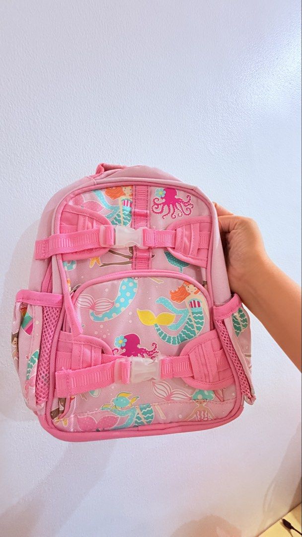 Pottery Barn Pink Mermaid Backpack for Kids (Category: Diaper Bags & Wetbags) located in San Juan City. Submitted by lexie_sky (Listing ID 1464397004, Image 1). Description: - Pottery Barn Mackenzie Backpack - Adorable pink backpack with a fun mermaid and octopus print. - Features adjustable straps for a comfortable fit. - Includes convenient side mesh pockets for small water bottles or essentials. - Ideal for school, daycare, or exciting day tri