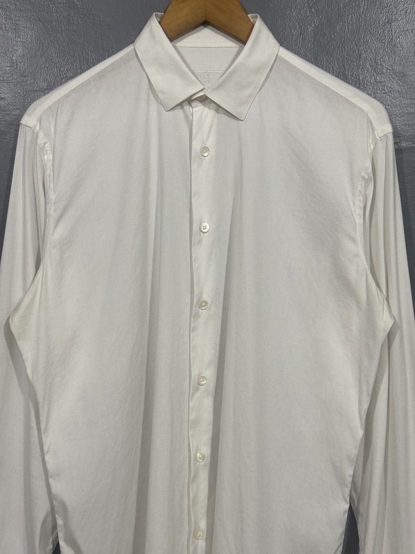 Prada - Men's Long Sleeve Polo (Category: Tshirts & Polo Shirts ) located in Manila. Submitted by sophisticatedgoons (Listing ID 1464369563, Image 3). Description: Prada Men's Casual White Long Sleeve Polo Size: 39 on tag Fits: Large men's In good condition No major flaws Measurements (inches): Chest: 22" Length: 30-31" (Back & Front) Shoulder: 18" Sleeves: 27".