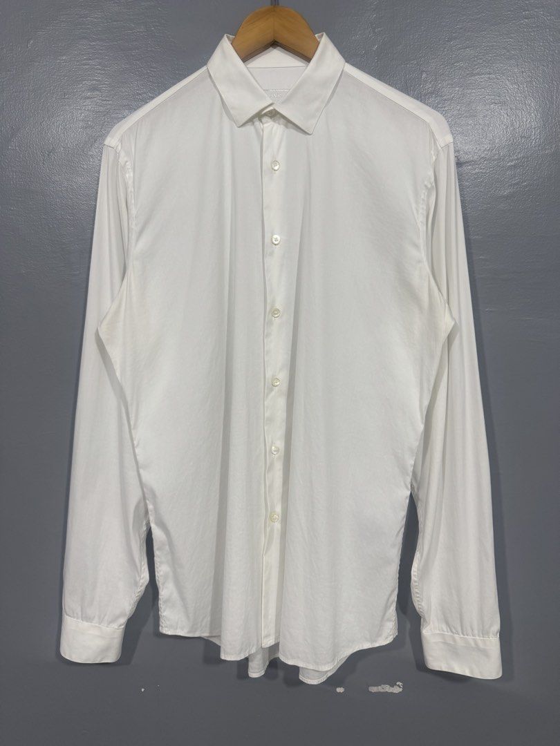 Prada - Men's Long Sleeve Polo (Category: Tshirts & Polo Shirts ) located in Manila. Submitted by sophisticatedgoons (Listing ID 1464369563, Image 2). Description: Prada Men's Casual White Long Sleeve Polo Size: 39 on tag Fits: Large men's In good condition No major flaws Measurements (inches): Chest: 22" Length: 30-31" (Back & Front) Shoulder: 18" Sleeves: 27".