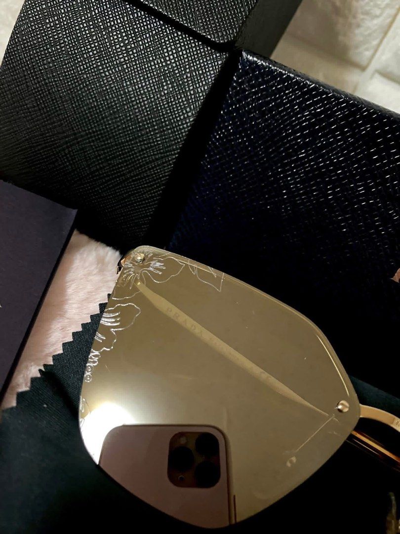 Prada Cinema irregular cat-eye sunglasses (Category: Sunglasses & Eyewear) located in Trece Martires City. Submitted by miladyoo9 (Listing ID 1464370322, Image 2). Description: - Authentic Prada Sunglasses - Elegant Gold Frame - Stylish Mirror Lenses - Comes with Original Box, Case, and Cleaning Cloth - Made in Italy.