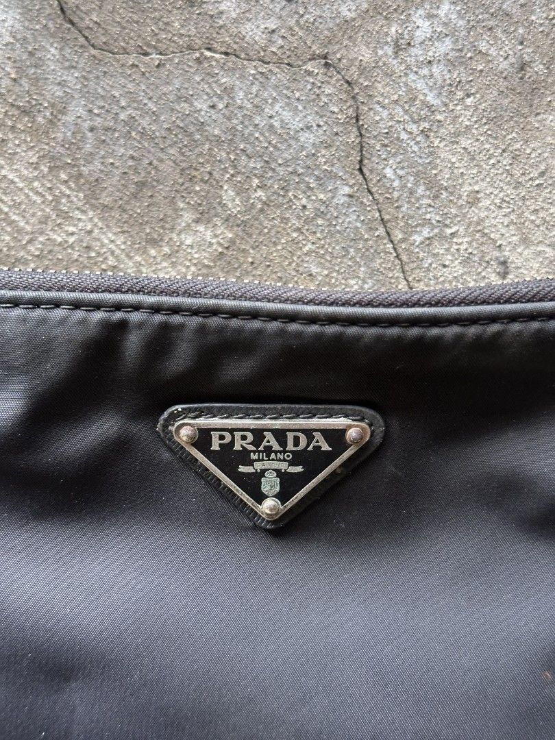 Prada Crossbody Econylon (Category: Cross-body Bags) located in Talisay. Submitted by bigheaddrake (Listing ID 1464475248, Image 2). Description: Prada Econylon Oxidations on hardwares No other issues 7/10 Condi.