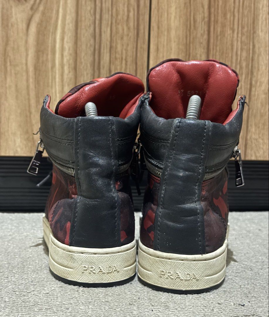 Prada Red Camo High-Top Sneakers size:35eu/ 25cm (Category: Sneakers) located in Taguig. Submitted by jhonnybusinessph (Listing ID 1464473513, Image 3). Description: Wts Pre-loved - Prada high-top sneakers - size 35eu/ 25cm - Eye-catching red camouflage pattern - Black leather accents and laces - Convenient side zippers - Durable rubber soles with Prada branding - Versatile and stylish for any outfit - condition: usedgood With minimal sign of usa