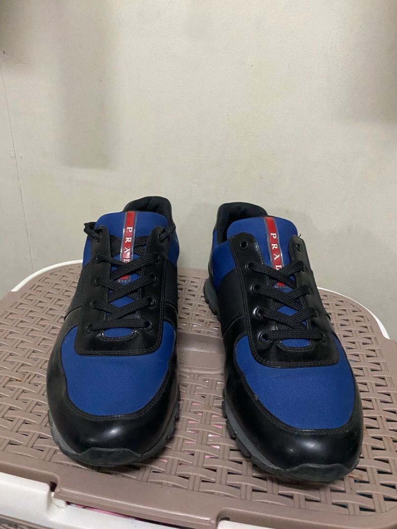 Prada Red Tab Low-Top Sneakers (Category: Sneakers & Footwear) located in San Mateo. Submitted by prelovedstuffsbycha (Listing ID 1464360085, Image 2). Description: Prada Red Tab Low-Top Sneakers (4E2718) ₱4000 Size: 11 US Still in good condition — no major flaws, just normal signs of use. No box included. 📍Location: San Mateo, Rizal Available for pick up or delivery (buyer’s cost). Message me if interested!.