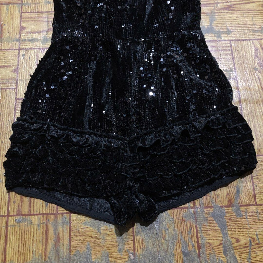 PRETTY LITTLE THING FEMME (Category: Others Tops) located in Dasmarinas. Submitted by corenyxmessy_3rd_account (Listing ID 1464554507, Image 3). Description: Sparkly PrettyLittleThing black sequin romper featuring a playful cutout tie neckline and ruffled hem details. width - 15 length - 30.