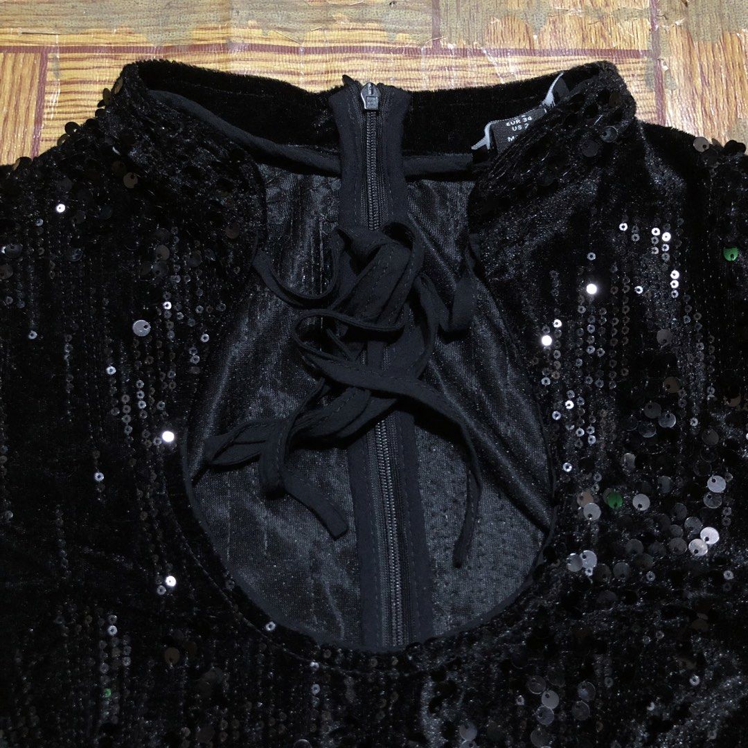 PRETTY LITTLE THING FEMME (Category: Others Tops) located in Dasmarinas. Submitted by corenyxmessy_3rd_account (Listing ID 1464554507, Image 2). Description: Sparkly PrettyLittleThing black sequin romper featuring a playful cutout tie neckline and ruffled hem details. width - 15 length - 30.