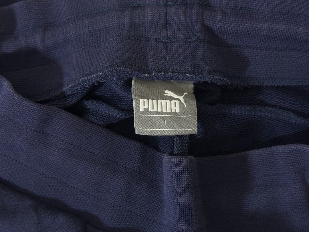 Puma Navy Blue Jogger Sweatpants Size L (Category: Other Bottoms) located in Baguio. Submitted by archivedbyj (Listing ID 1464391395, Image 2). Description: - Navy blue Puma sweatpants - Size: Large (L) - Puma logo on the left leg - Elastic waistband with drawstring - Two side pockets - Comfortable for lounging, workouts, or everyday wear.