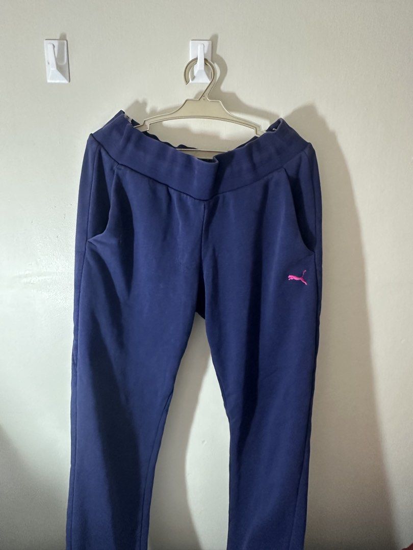 Puma Navy Blue Jogger Sweatpants Size L (Category: Other Bottoms) located in Baguio. Submitted by archivedbyj (Listing ID 1464391395, Image 1). Description: - Navy blue Puma sweatpants - Size: Large (L) - Puma logo on the left leg - Elastic waistband with drawstring - Two side pockets - Comfortable for lounging, workouts, or everyday wear.