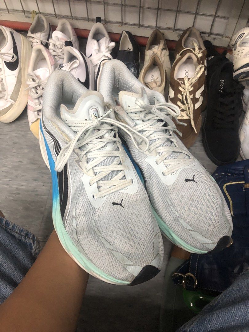 Puma Velocity 4 Running Shoes (Category: Sneakers) located in Cavite. Submitted by thriftkicks3 (Listing ID 1464462399, Image 2). Description: - Puma Nitro running shoes - Color: Light grey with blue and mint green sole accents - Closure: Lace-up - Ideal for: Running or casual wear - Condition: Minor scuffs on sole from normal use, still has lots of life left.
