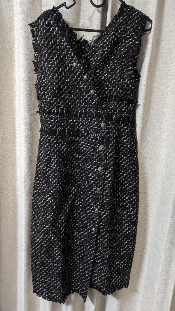 Pure Tweed Buttoned Dress (Category: Dresses) located in Cabuyao City. Submitted by alycarrou11 (Listing ID 1464373358, Image 2). Description: - Elegant black and white tweed dress - Sleeveless with a flattering V-neckline - Unique frayed trim details on neckline, waist, and hem - Classic button-down front with stylish silver-tone buttons - Fitted silhouette for a sophisticated look - Ideal for special events or a glamorous night out.