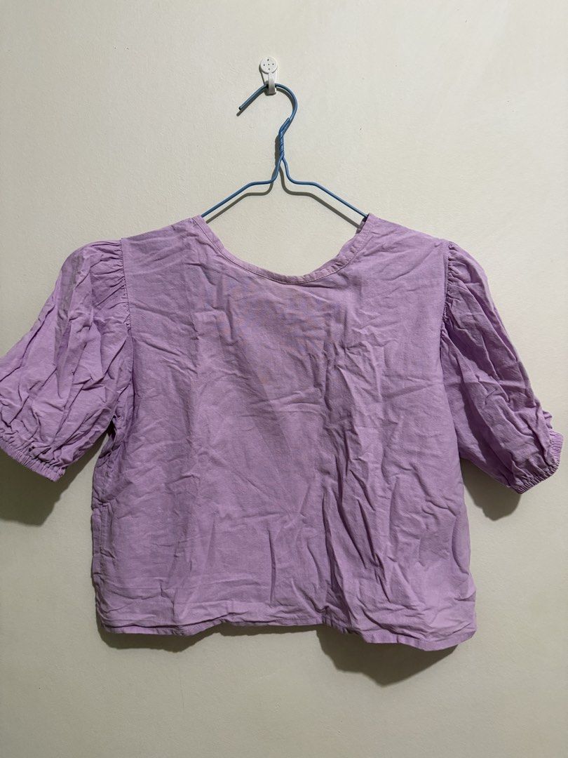 Purple Puff Sleeve Top (Category: Blouses) located in San Fernando. Submitted by richeloy (Listing ID 1464570234, Image 1). Description: - Adorable purple top - Features stylish puff sleeves with elasticated cuffs - Designed for a relaxed fit - Ideal for casual outings - Versatile piece, pairs well with jeans or skirts.