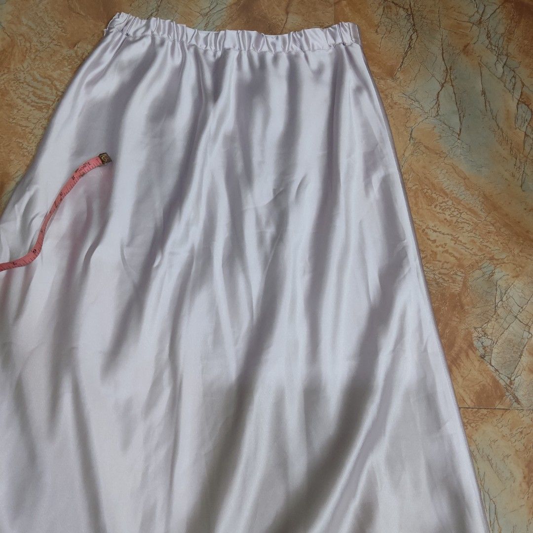 Purple Satin A-Line Midi Skirt (Category: Skirts) located in Valenzuela. Submitted by 0003c4 (Listing ID 1464444539, Image 3). Description: Elegant satin midi skirt, very good condition White/lilac-toned finish Flowy A-line silhouette Waist: approx. 14" flat, Length: approx. 38–39" Location: Valenzuela City Delivery: Lalamove or J&T PM for price/details 💌.