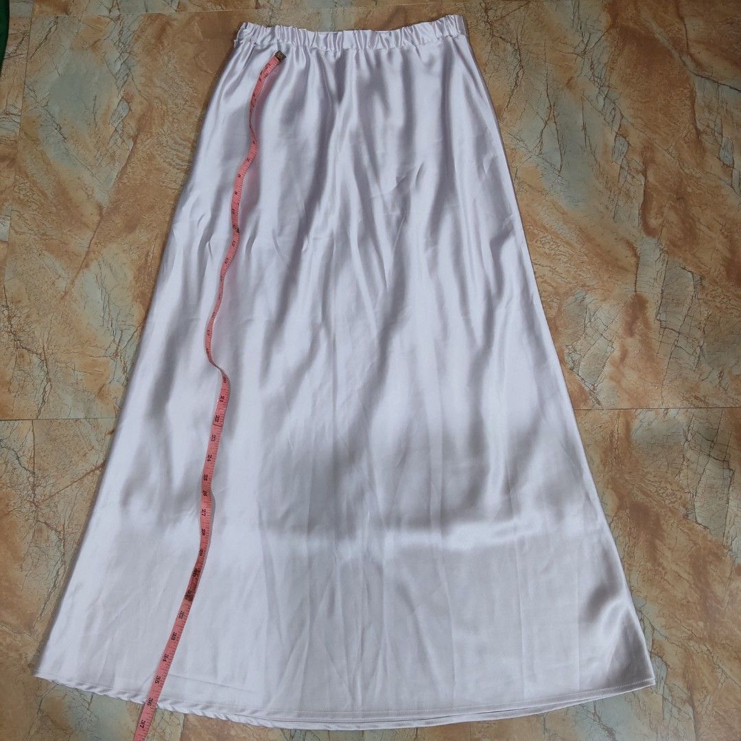 Purple Satin A-Line Midi Skirt (Category: Skirts) located in Valenzuela. Submitted by 0003c4 (Listing ID 1464444539, Image 1). Description: Elegant satin midi skirt, very good condition White/lilac-toned finish Flowy A-line silhouette Waist: approx. 14" flat, Length: approx. 38–39" Location: Valenzuela City Delivery: Lalamove or J&T PM for price/details 💌.