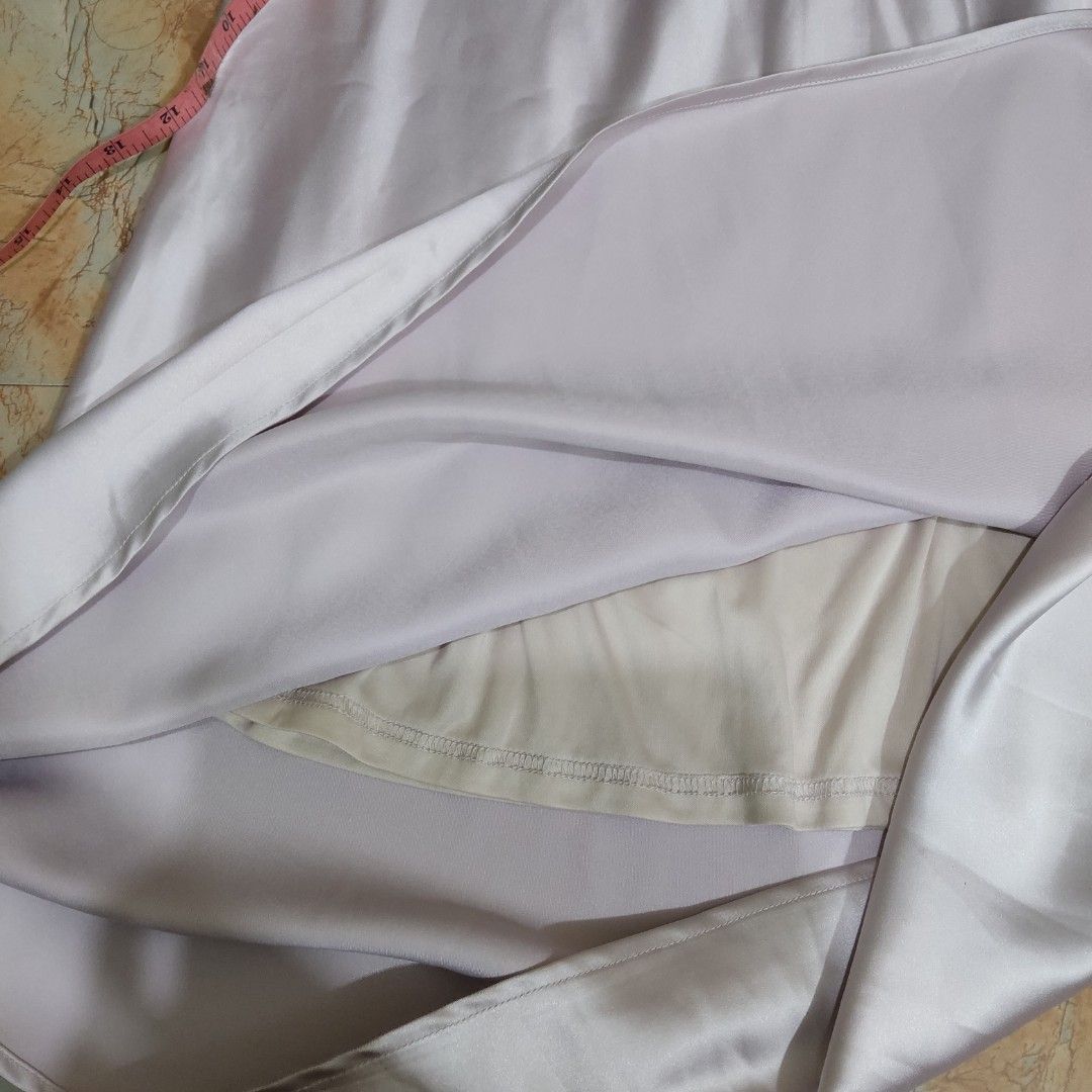 Purple Satin A-Line Midi Skirt (Category: Skirts) located in Valenzuela. Submitted by 0003c4 (Listing ID 1464444539, Image 2). Description: Elegant satin midi skirt, very good condition White/lilac-toned finish Flowy A-line silhouette Waist: approx. 14" flat, Length: approx. 38–39" Location: Valenzuela City Delivery: Lalamove or J&T PM for price/details 💌.
