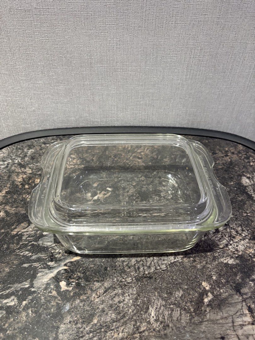 Pyrex Glass Baking Dish with Chipped Lid (Category: Bakeware) located in Manila. Submitted by foundhouseph (Listing ID 1464501604, Image 1). Description: - Pyrex clear glass baking dish - Price: 300php - Includes matching chipped lid - Dimensions: 9 inches (length) x 7 inches (width) x 4 inches (height) - Perfect for baking or food storage - Dishwasher safe - Approximate size: 8x8 inches.