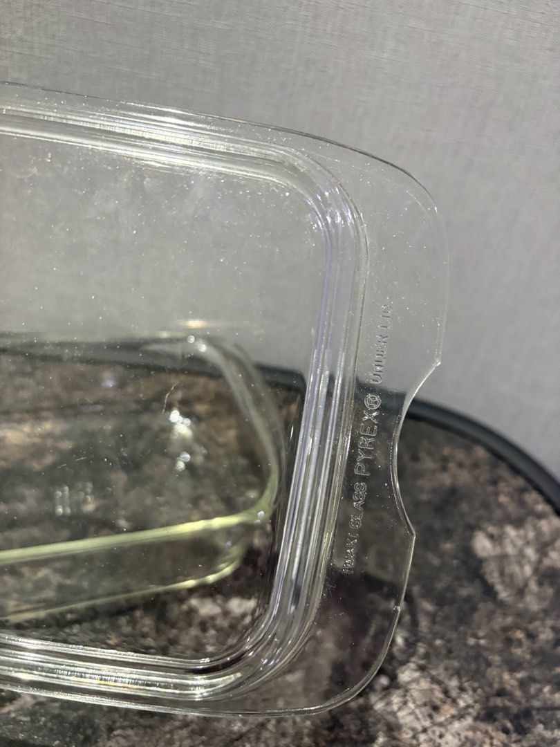 Pyrex Glass Baking Dish with Chipped Lid (Category: Bakeware) located in Manila. Submitted by foundhouseph (Listing ID 1464501604, Image 3). Description: - Pyrex clear glass baking dish - Price: 300php - Includes matching chipped lid - Dimensions: 9 inches (length) x 7 inches (width) x 4 inches (height) - Perfect for baking or food storage - Dishwasher safe - Approximate size: 8x8 inches.