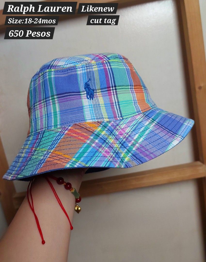 Ralph Lauren Bucket Hat 18-24mos (Category: Babies & Kids Fashion) located in Caloocan City. Submitted by clairyyyyy (Listing ID 1464469503, Image 1). Description: - Ralph Lauren bucket hat - Reversible: Plaid pattern on one side, solid blue on the other - Size: 18-24 months - Condition: Cut tag - Perfect for your little one's sunny adventures!.