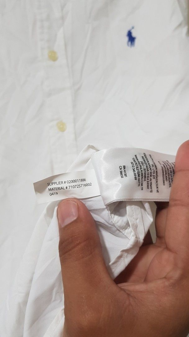Ralph Lauren Slim Fit Performance White Button Down Shirt (Category: Tshirts & Polo Shirts ) located in Manila. Submitted by nice430 (Listing ID 1464364340, Image 3). Description: - Brand: Ralph Lauren - Color: White - Fit: Slim Fit - Style: Performance Button-Down Shirt - Features: Embroidered classic polo player logo on chest, button closure, button cuffs - Occasion: Perfect for casual or smart-casual outfits.