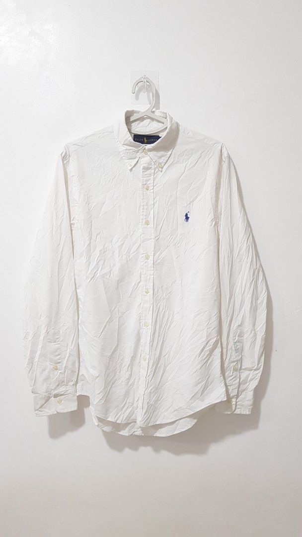 Ralph Lauren Slim Fit Performance White Button Down Shirt (Category: Tshirts & Polo Shirts ) located in Manila. Submitted by nice430 (Listing ID 1464364340, Image 1). Description: - Brand: Ralph Lauren - Color: White - Fit: Slim Fit - Style: Performance Button-Down Shirt - Features: Embroidered classic polo player logo on chest, button closure, button cuffs - Occasion: Perfect for casual or smart-casual outfits.