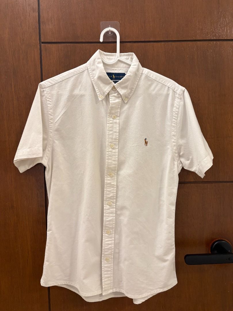 Ralph Lauren White Short-Sleeve Oxford (Category: Tshirts & Polo Shirts ) located in Mandaluyong City. Submitted by jbor88 (Listing ID 1464365213, Image 2). Description: Classic Ralph Lauren short sleeve shirt Made from durable Oxford fabric Modern slim fit cut Features the iconic embroidered polo player logo Stylish button-down collar Slim Fit US S/P W=47cm L=67cm.