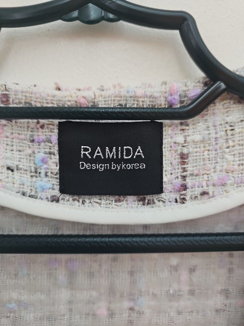 RAMIDA Design by Korea Tweed Cropped Jacket (Category: Coats, Jackets and Outerwear) located in Muntinlupa City. Submitted by shoptitak (Listing ID 1464396913, Image 3). Description: - Cute cropped tweed jacket from RAMIDA - Textured fabric with multi-colored threads - Front button closures - Versatile for layering over tops or dresses - Adds a chic touch to any outfit.