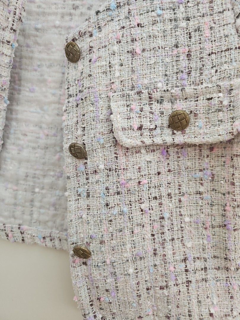 RAMIDA Design by Korea Tweed Cropped Jacket (Category: Coats, Jackets and Outerwear) located in Muntinlupa City. Submitted by shoptitak (Listing ID 1464396913, Image 2). Description: - Cute cropped tweed jacket from RAMIDA - Textured fabric with multi-colored threads - Front button closures - Versatile for layering over tops or dresses - Adds a chic touch to any outfit.