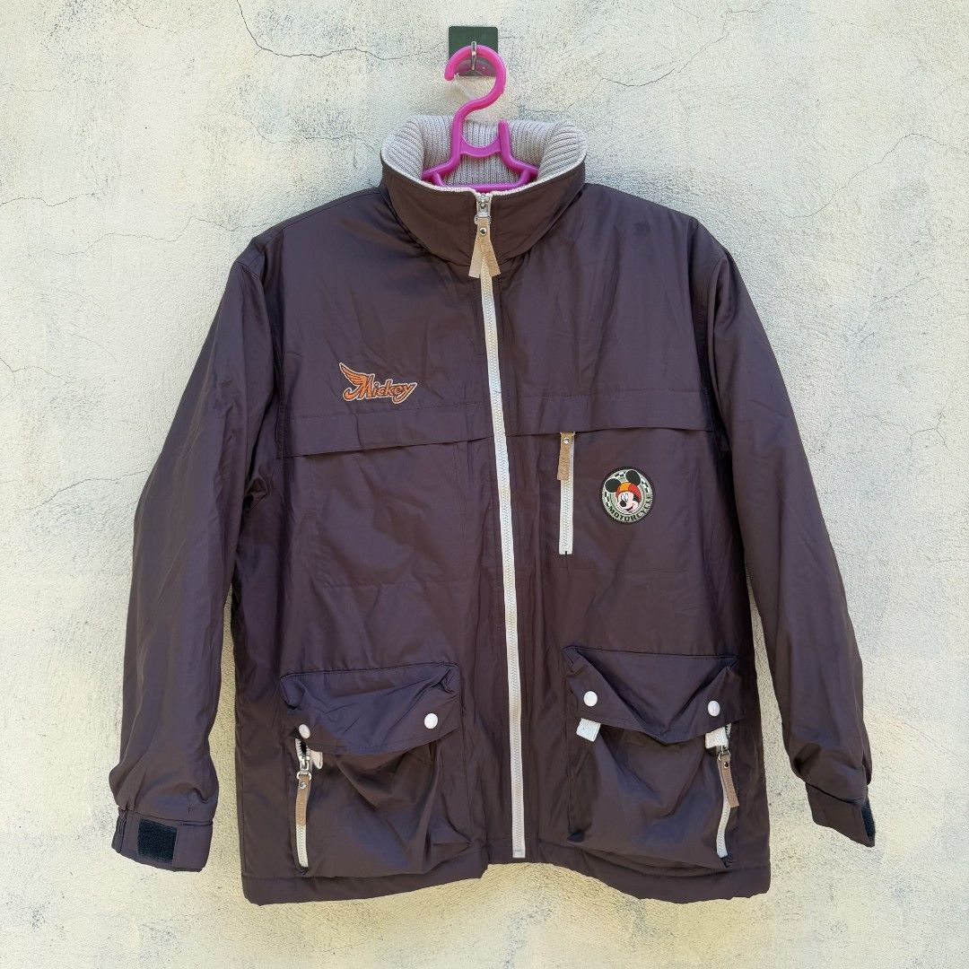 Rare Vintage Mickey Mouse Motorcycle Jacket (Category: Coats, Jackets and Outerwear) located in Bangued. Submitted by c.ceekay (Listing ID 1464488223, Image 2). Description: ​Vintage Mickey Mouse Motorcycle Club Jacket size 14 kids ( pwede po pang adult) small to medium kasya Dark brown utility jacket featuring embroidered "Mickey" chest graphic, vintage Mickey Motorcycle patch, high neck collar, and tons of pocket details. Perfect piece for stre