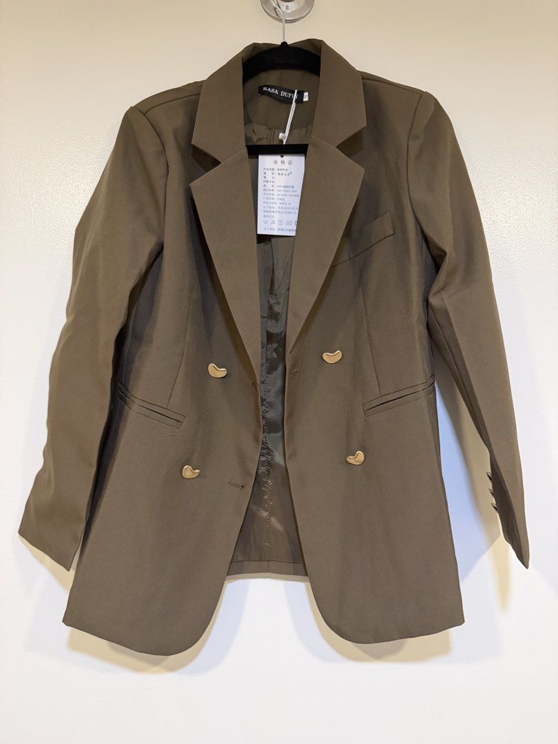 Rasa Duffy Double Breasted Blazer (Category: Coats, Jackets and Outerwear) located in Mandaluyong City. Submitted by closet.me (Listing ID 1464479513, Image 1). Description: - brown double-breasted blazer - Features elegant gold button details - Fully lined for a comfortable fit - Estimated size: Small (S) - Ideal for both casual and formal styling - Perfect for office wear or evening events.