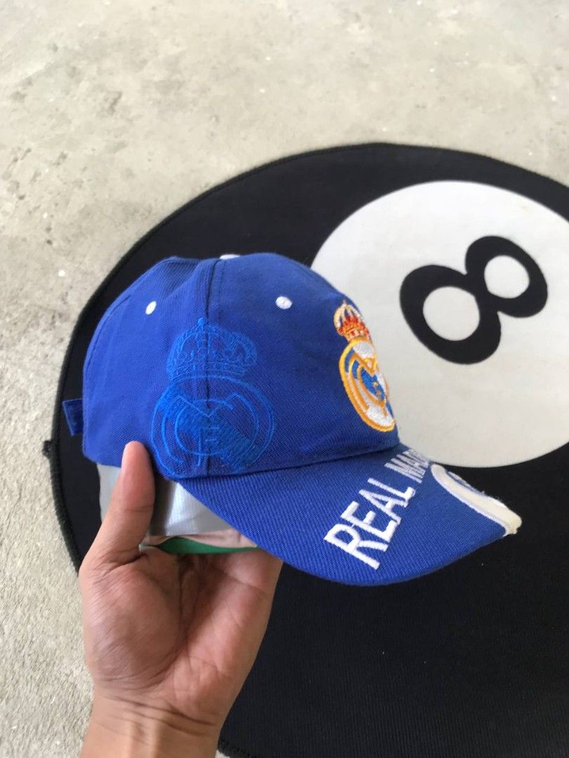 Real Madrid Blue Baseball Cap (Category: Caps & Hats) located in Bayambang. Submitted by marvinarenasph (Listing ID 1464391517, Image 3). Description: Official Real Madrid cap in blue. 'REAL MADRID' text proudly displayed across the brim. Adjustable strap at the back for a comfortable, customized fit. Good Condition Price: 350 📍Location Bautista Pangasinan.