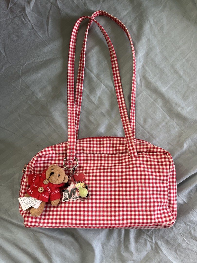 Red Gingham Shoulder Bag (Category: Shoulder Bags) located in Iloilo. Submitted by warmspicyyy (Listing ID 1464370673, Image 1). Description: - pnshoppe red gingham shoulder bag - similar to Baggu bags - Secure double zip closure - Very spacious inside, it can fit my sunnies tumbler - pop of color for every outfit - i use this during my errands since it holds a lotta stuff.