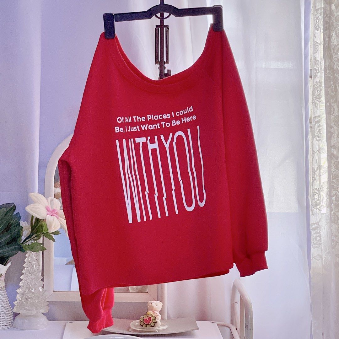 Red Off-Shoulder Sweatshirt with "WITH YOU" Graphic (Category: Longsleeves) located in Las Pinas. Submitted by Kungjunim_Preloves (Listing ID 1464369802, Image 2). Description: Super cute and aesthetic vibrant red sweatshirt featuring an off-shoulder/wide-neck design and white typography text: “Of All The Places I Could Be, I Just Want To Be Here WITH YOU.” ❤️ Perfect for effortless street style, pairing with denim shorts, or baggy cargo pants! I