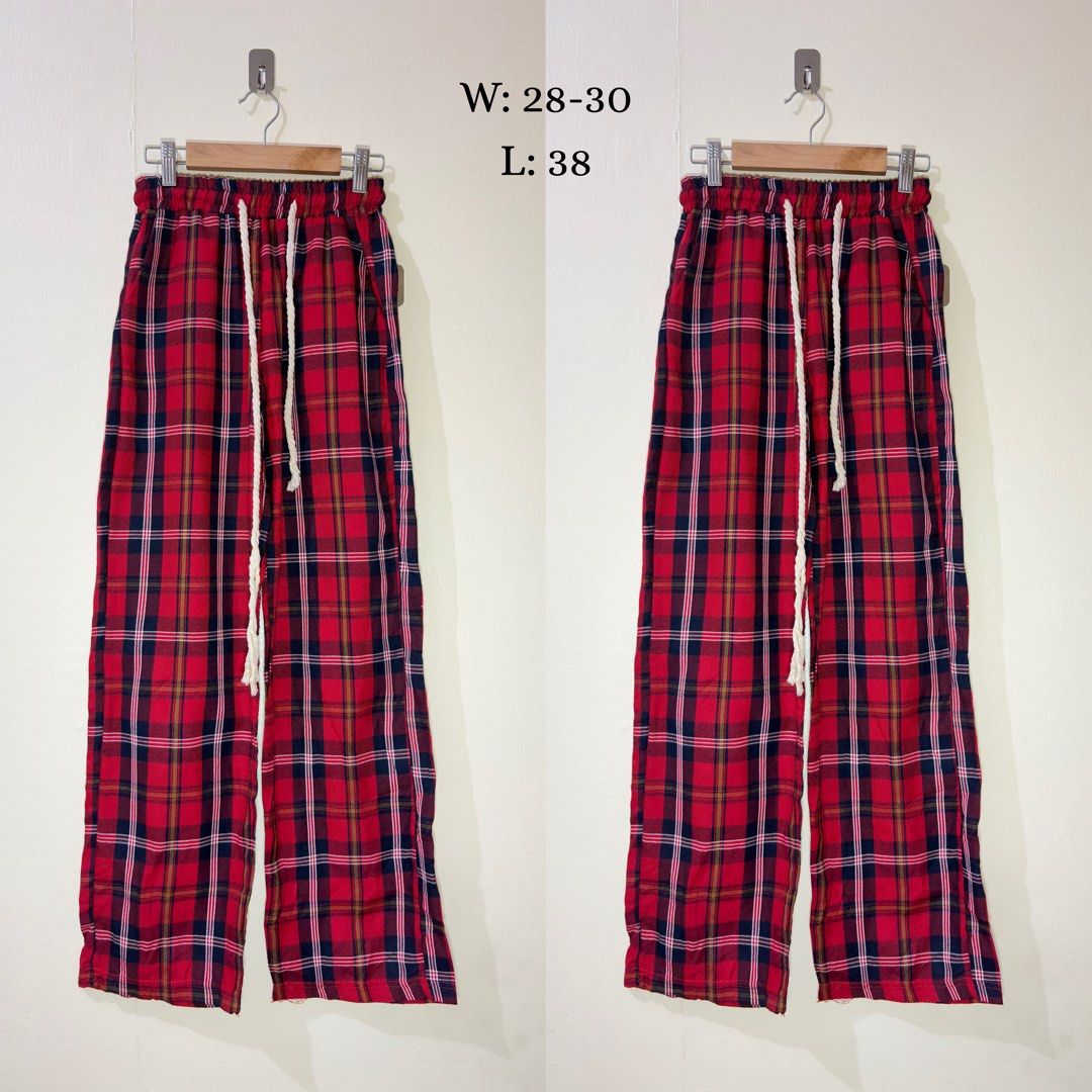 Red Plaid Lounge Pants with Drawstring Waist (Category: Joggers) located in Manila. Submitted by thrift.buddy.em (Listing ID 1464562533, Image 2). Description: - Comfy red plaid pants - Drawstring waist for a great fit - Wide leg style, ideal for lounging - Tag indicates size M - Versatile for home relaxation or casual outings.