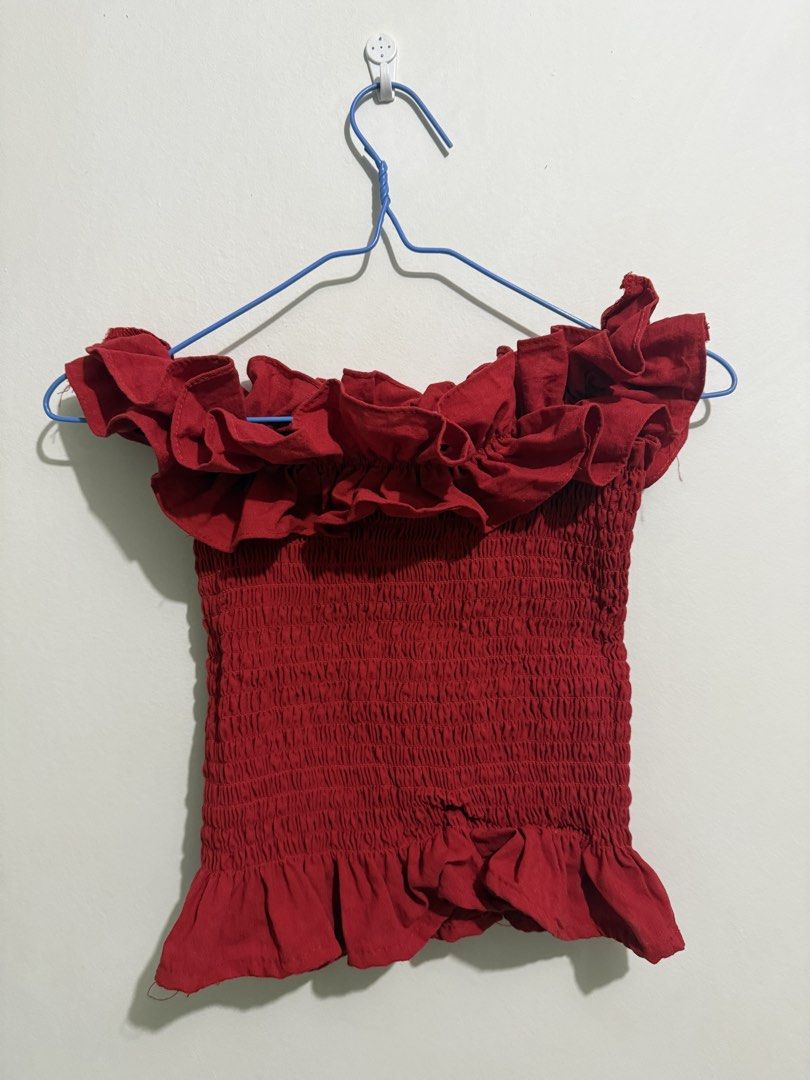 Red Smocked Off-Shoulder Ruffle Crop Top (Category: Blouses) located in San Fernando. Submitted by richeloy (Listing ID 1464570090, Image 1). Description: - Adorable red crop top - Smocked all over for a stretchy, comfortable fit - Features charming ruffles at the neckline and hem - Versatile design: can be worn on or off the shoulder - Ideal for both casual outings and nights out.