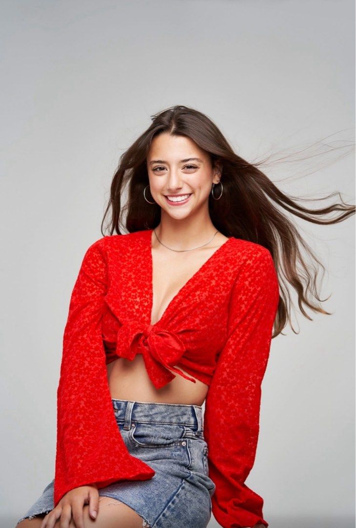 Red Tie-Front Long Sleeve Crop Top (Category: Longsleeves) located in Naga. Submitted by cozydapper (Listing ID 1464428395, Image 1). Description: - Cute red tie-front crop top - Long bell sleeves - Textured fabric with subtle pattern - Pairs well with jeans or high-waisted pants - Perfect for casual days or nights out.