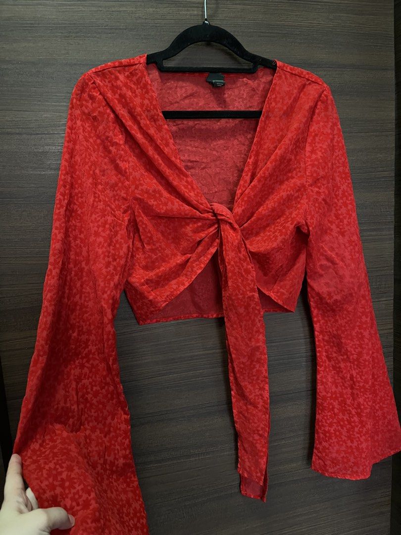 Red Tie-Front Long Sleeve Crop Top (Category: Longsleeves) located in Naga. Submitted by cozydapper (Listing ID 1464428395, Image 3). Description: - Cute red tie-front crop top - Long bell sleeves - Textured fabric with subtle pattern - Pairs well with jeans or high-waisted pants - Perfect for casual days or nights out.