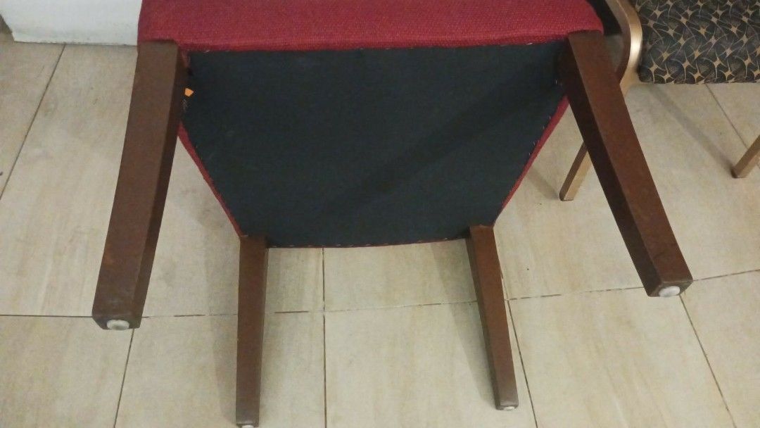 Red Upholstered Armchair with Cutout Back (Category: Chairs) located in Las Pinas. Submitted by jesus1smysavi0r (Listing ID 1464359471, Image 1). Description: - Comfortable armchair with a unique backrest cutout. - Upholstered in a textured red fabric. - Sturdy wooden legs. - Perfect for adding a vibrant accent to any room..