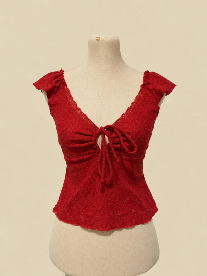 Rosé Ruched Lace Top (Category: Sleeveless) located in Angeles City. Submitted by thebeehivecloset (Listing ID 1464492810, Image 1). Description: Short Description: A feminine lace top featuring ruched details, ruffled sleeves, and a front tie for a flattering and stylish look..