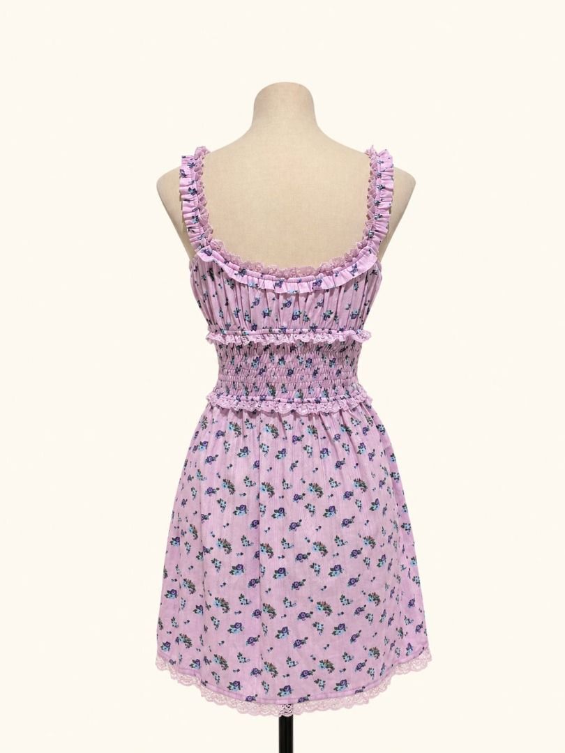 Rosie Bloom Mini Dress (Category: Dresses) located in Angeles City. Submitted by thebeehivecloset (Listing ID 1464488824, Image 2). Description: A cute and feminine floral mini dress featuring a smocked bodice, delicate ruffle details, lace accents, and a sweet bow for a soft vintage-inspired look.
