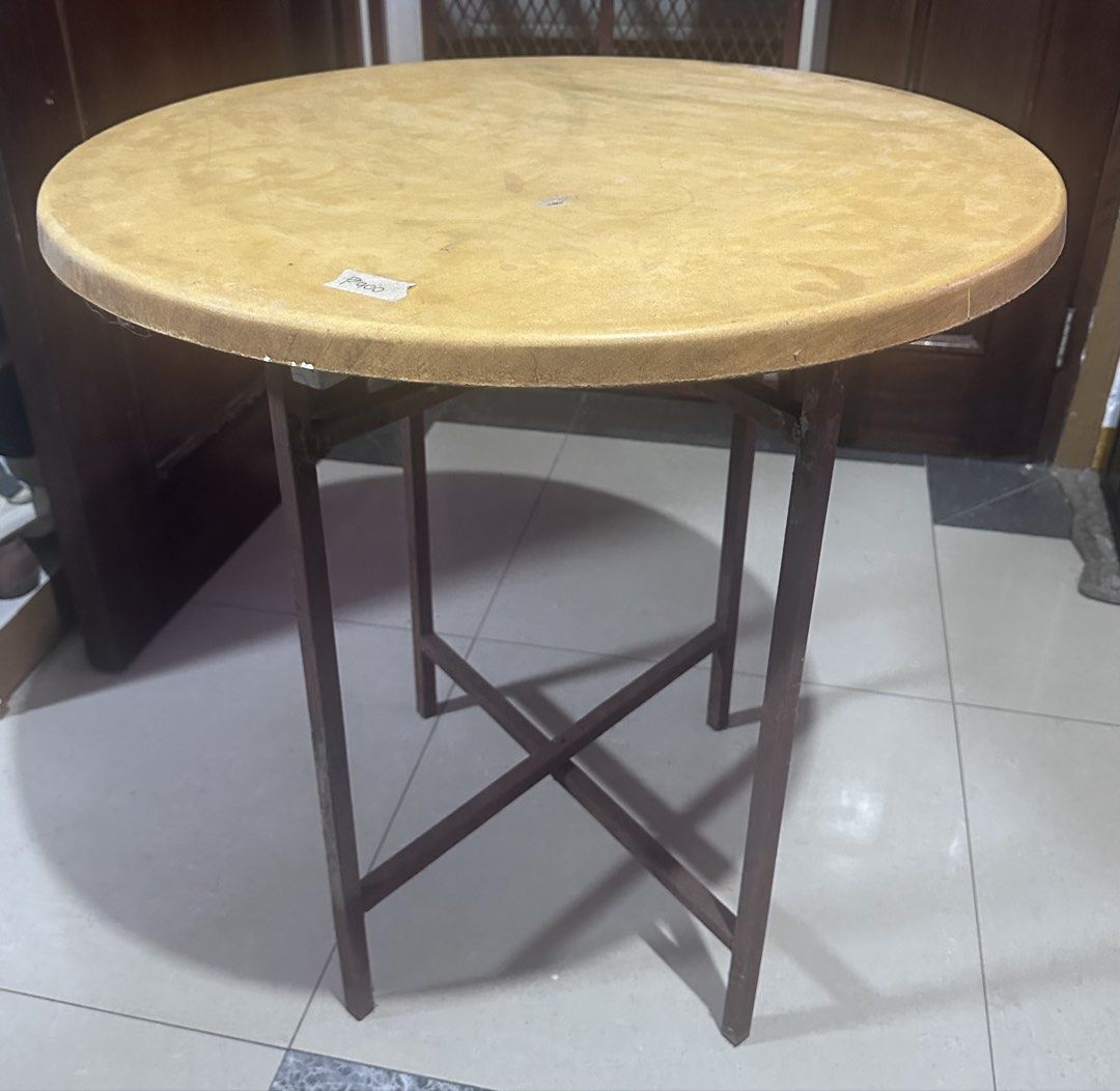 Round Table with Removable, Folding, Metal Stand (Category: Tables & Sets) located in Manila. Submitted by zuripot0726 (Listing ID 1464457434, Image 3). Description: 💵 price is negotiable - Round folding table with light brown tabletop - Sturdy metal stand - Removable table top and also foldable for easy storage - Ideal for small spaces, balconies, or as an extra surface - Dimensions: ✅ table top: 27.25in (diameter) x ~1.25in (H) ✅ metal stand (