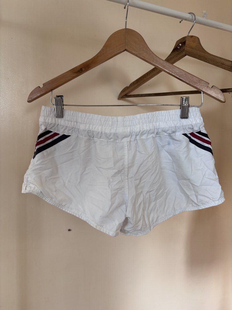 Roxy White Athletic Shorts with Stripes (Category: Shorts) located in Manila. Submitted by galitsabarat (Listing ID 1464516272, Image 2). Description: - White Roxy athletic shorts - Elastic waistband with adjustable drawstring - Stylish striped details on the sides - Flattering V-shape detail on the back - Small, iconic Roxy logo at the bottom back - Versatile for sports activities or everyday casual wear.