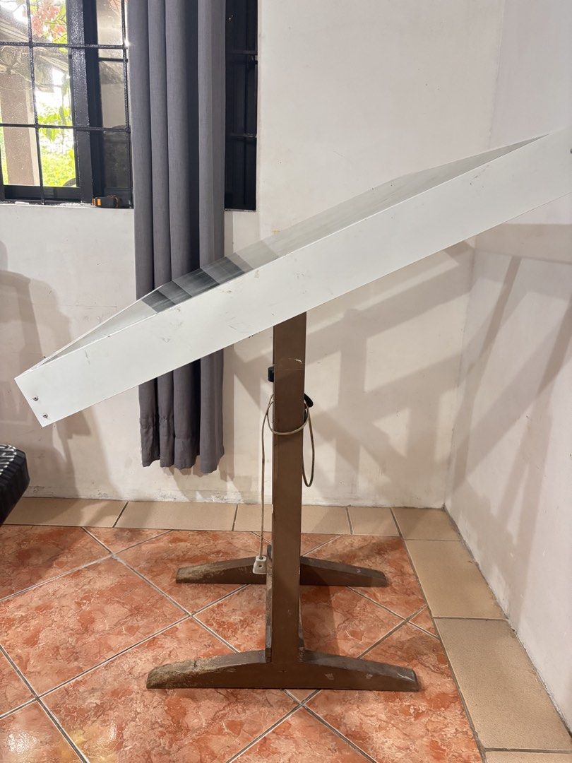 RUSH‼️ drafting table (Category: Tables & Sets) located in Manila. Submitted by .chew (Listing ID 1464419326, Image 2). Description: RUSH‼️ used drafting table made with Tempered Glass, Aluminum Frame, and Wood legs sold as is. rfs: di na nagagamit. nakatambak lang..