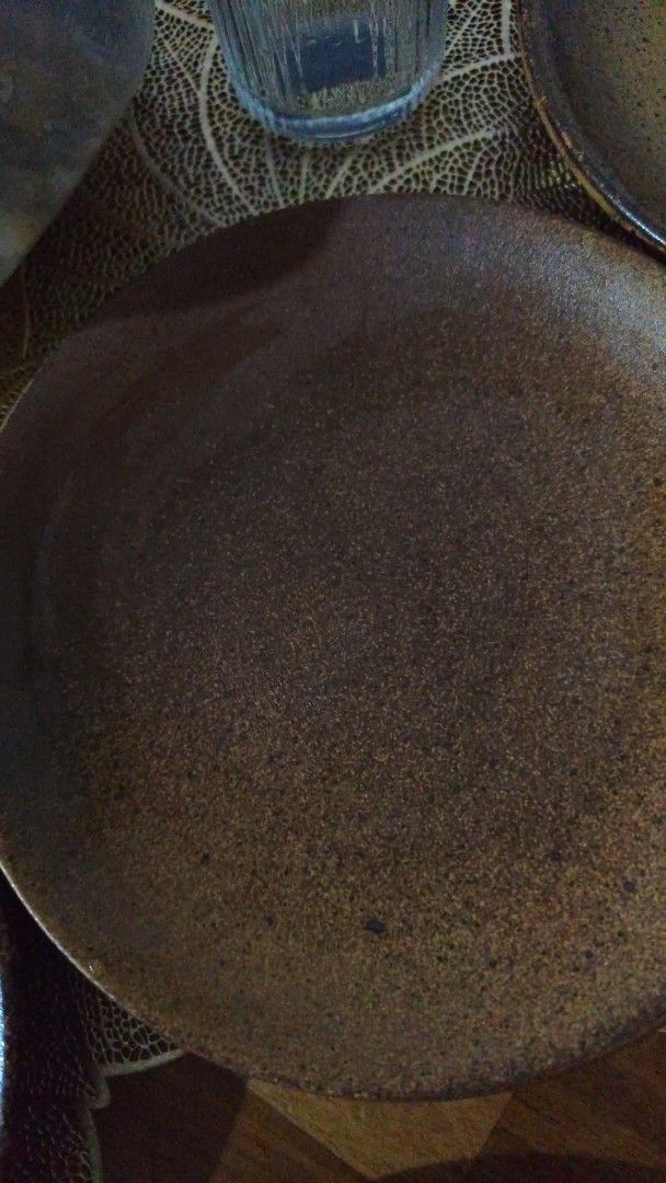 Rustic Ceramic Plate with Speckled Glaze (Category: Dinnerware & Cutlery) located in Manila. Submitted by marriage031073advocate (Listing ID 1464441238, Image 3). Description: - Earthy toned ceramic plate - Speckled glaze with a darker rim - Light, matte finish inside - Subtle concentric circle detail on the interior - Versatile: great for serving food or as a decorative piece - Unique, handmade aesthetic - Set of 6 plates + 1 extra .
