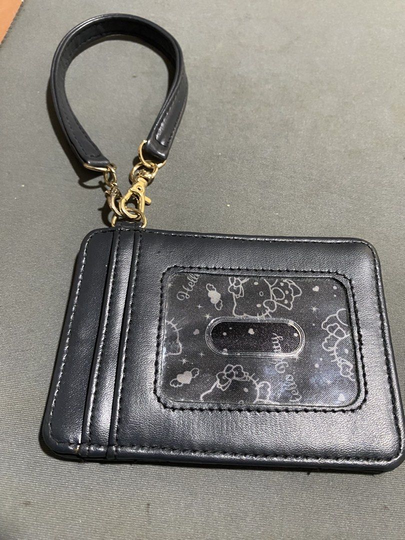Sanrio Black Quilted Hello Kitty Card Holder with Strap (Category: Wallets & Card holders) located in San Juan City. Submitted by fastturtle_d9ad50 (Listing ID 1464360366, Image 2). Description: Sanrio Black Quilted Hello Kitty Card Holder with Strap - Black quilted card holder - Clear window for ID or cards - Detachable wrist strap included.