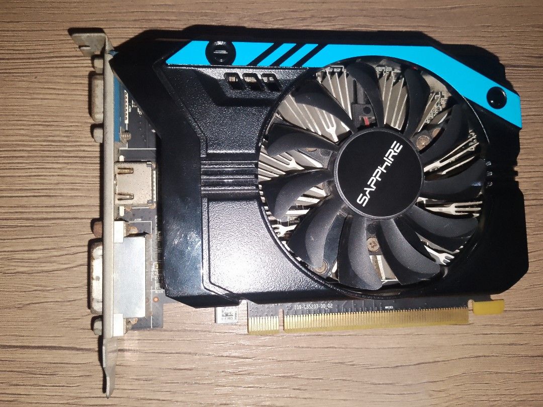 Sapphire Amd r7 240 1gb Graphics Card GPU (Category: Computer Parts) located in Manila. Submitted by samuel2729 (Listing ID 1463699330, Image 2). Description: - Sapphire Graphics Card GPU - Single Fan Design - Ports: VGA, HDMI, DVI - Tested and Working - Minor dust on fan - 1gb vram -Freshly thermal pasted honest issue: small rusts and dusty rfs: upgrade to a new one.