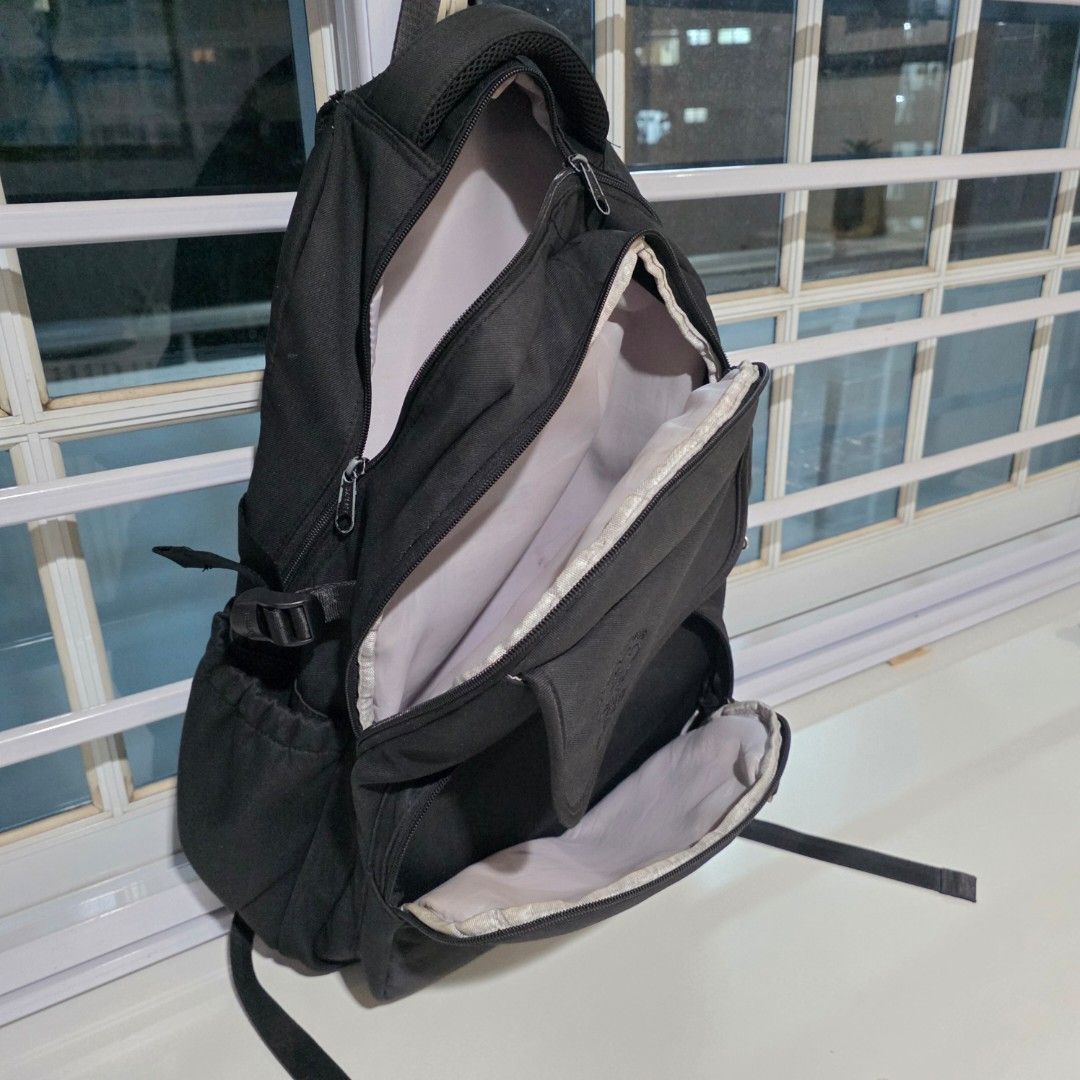 School Backpack (Category: Backpacks) located in Singapore. Submitted by niner2niner (Listing ID 1464433394, Image 2). Description: - Black backpack with many compartment - used but still in good working condition - Main zip closure - Front zip pocket - Smaller front pocket with button closure - Adjustable straps - Minor fraying on one strap attachment (refer to last photo for details).