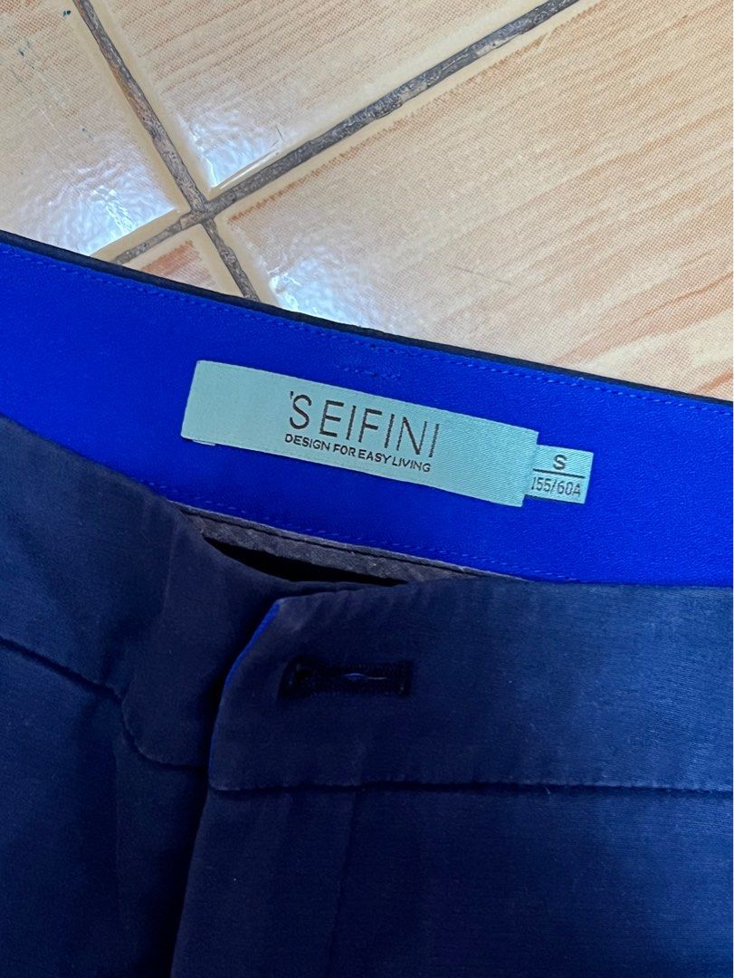 SEIFINI Navy Blue Shorts Size S (Category: Shorts) located in Marikina City. Submitted by julmograsell (Listing ID 1464486977, Image 3). Description: - Brand: SEIFINI - Color: Navy Blue - Size: S - Accent: Bright blue on sides - Pockets: Two at the back - Closure: Button and zip at the front - Style: Great for casual wear.